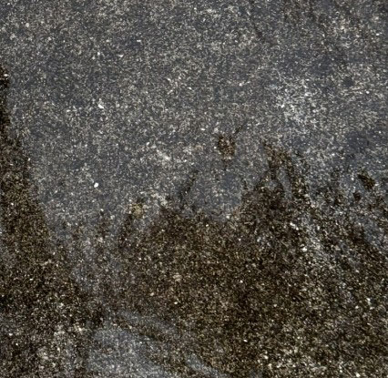 Dirt-stained concrete in Lynchburg, VA before pressure washing